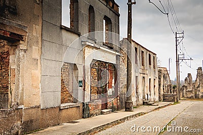 In the village streets, remains in ruins of houses destroyed by Editorial Stock Photo