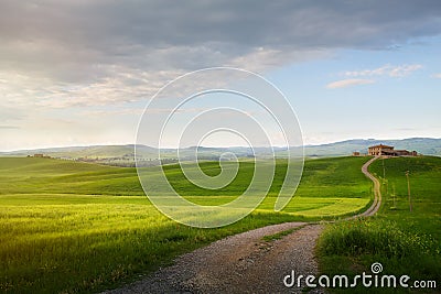 village in tuscany; Italy countryside landscape with Tuscany rolling hills ; sunset over the farm land and country road Stock Photo