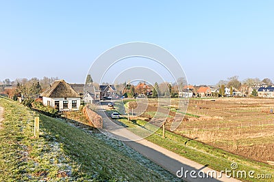 Village view Waardenburg with original village houses in polder landscape Stock Photo