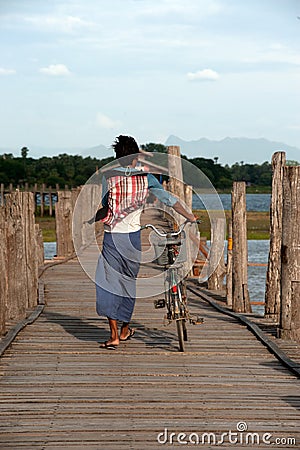 Villagers bike trailers on Uben bridge,Myanmar. Editorial Stock Photo