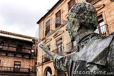 Villanueva de los Infantes square and Don Quixote statue in the foreground Editorial Stock Photo