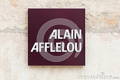 Alain Afflelou logo on a wall Editorial Stock Photo