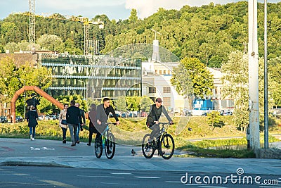 Vilnius, the capital of Lithuania, people riding bicycle Editorial Stock Photo