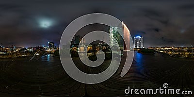 VILNIUS, LITHIUANIA - NOVEMBER 2019: full seamless spherical hdri night panorama 360 degrees angle view area of modern skyscrapers Editorial Stock Photo