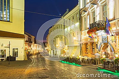 Vilnius Lithuania. Deserted Pilies Street Of Old Town In Bright Evening Illumination, Narutis Hotel Editorial Stock Photo