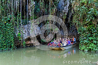 VINALES, CUBA - FEB 18, 2016: Tourists in a boat are leaving Cueva del Indio cave in National Park Vinales, Cub Editorial Stock Photo