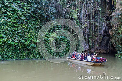 VINALES, CUBA - FEB 18, 2016: Tourists in a boat are leaving Cueva del Indio cave in National Park Vinales, Cub Editorial Stock Photo