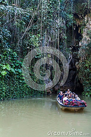 VINALES, CUBA - FEB 18, 2016: Tourists in a boat are leaving Cueva del Indio cave in National Park Vinales, Cub Editorial Stock Photo