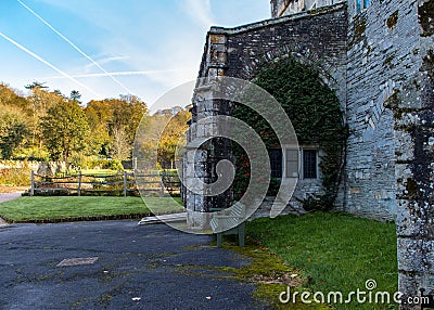 Vine with Berries fills an Arch an an Ancient Abbey in Autumn Editorial Stock Photo