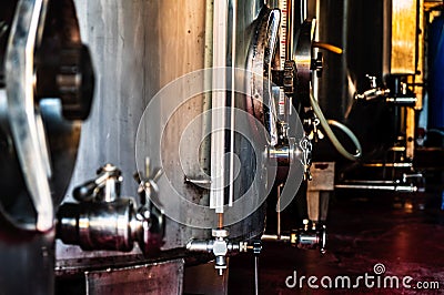 Vinery facility silos factory background faucet close up Stock Photo