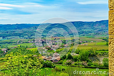 Vineyards and countryside in Beaujolais, with the village Saint-Laurent-d-Oingt Stock Photo