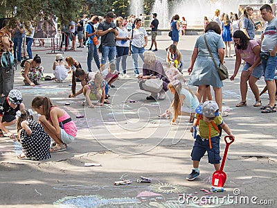 Vinnitsa, Ukraine. 08/24/2019. Children draw on the pavement with chalk Editorial Stock Photo