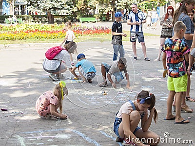 Vinnitsa, Ukraine. 08/24/2019. Children draw on the pavement with chalk Editorial Stock Photo