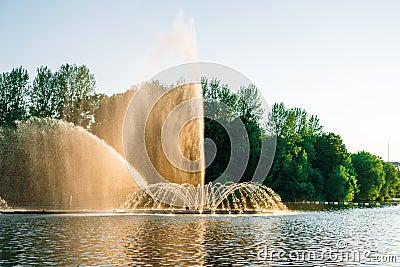 Vinnitsa, Ukraine. Dancing fountain on the river. Beautiful fountain on sunset background Stock Photo