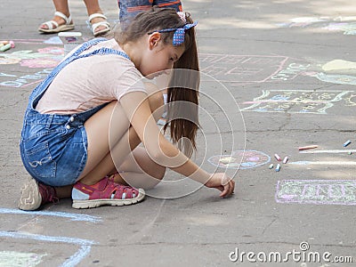 Vinnitsa, Ukraine. 08/24/2019. Children draw on the pavement with chalk Editorial Stock Photo