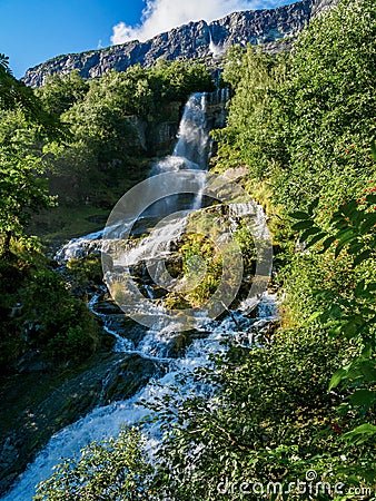 Vinnufossen, a beautiful waterfall flushing down a mountainside in Sunndal, Norway Stock Photo