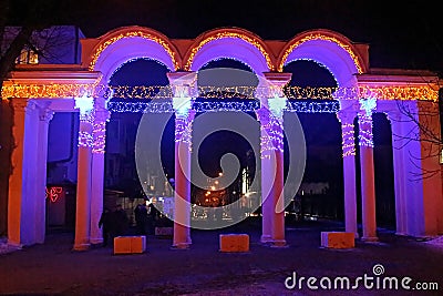 Unidentified people near entrance to Gorkyi park with New year decorations, Vinnytsia, Ukraine Editorial Stock Photo