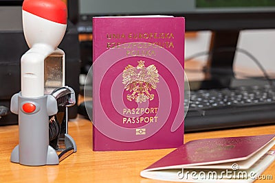 Vinous biometric passport of a Polish citizen with a border date stamper, close-up. Inscription - European Union, Republic of Stock Photo