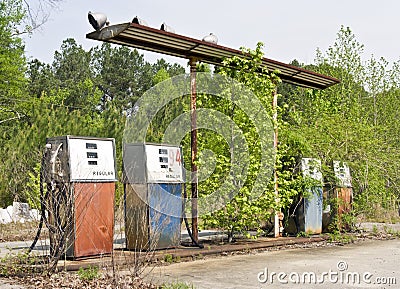 Vintage abandoned overgrown gas station Editorial Stock Photo