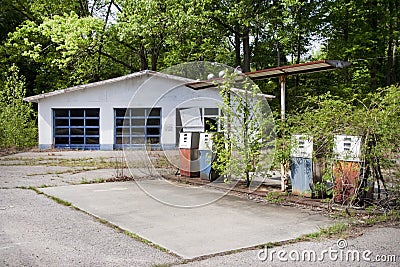 Vintage abandoned overgrown gas station Editorial Stock Photo