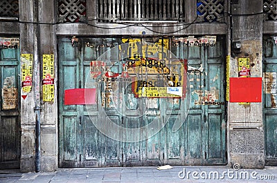 Vintage advertisement papers paste on the wall in Chinatown, Ban Editorial Stock Photo