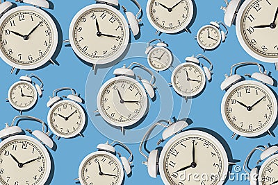 Vintage alarm clock pattern on a blue background, minimal style Stock Photo