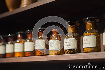 Vintage alchemy chemistry workshop rack shelf glass vials Stock Photo