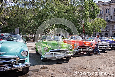 Vintage american cars parked in the main street of Old Havana Editorial Stock Photo