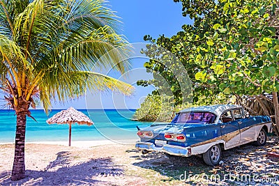 Vintage american oldtimer car on a beach in Cuba Stock Photo