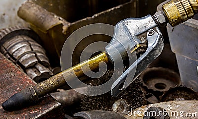 Vintage antique automotive machine shop air compressor hose nozzle with a brass neck and rubber tip Stock Photo