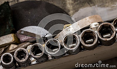 Vintage antique automotive machine shop hardened well used steel shallow impact socket set Stock Photo