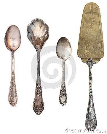 Vintage Antique silverware isolated on white background. Retro teaspoons, forks, knives, shovels for cake Stock Photo