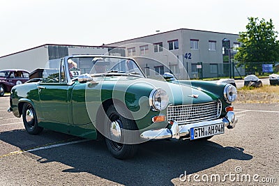 A vintage Austin Healey Sprite Mark 4 stands in the parking lot in front of the Burgenland classic. Editorial Stock Photo