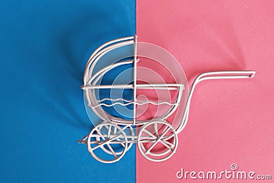 Vintage baby stroller on pink and blue background. Boy or girl question Stock Photo