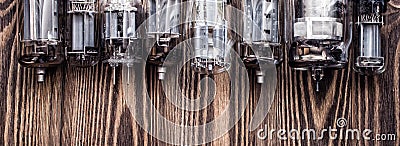 Vintage background with glass vacuum radio tubes. photo with retro filter. Stock Photo