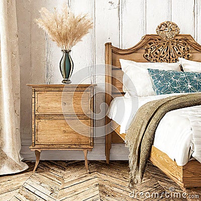 Vintage bedside nightstand near wooden bed. Farmhouse, country, provence interior design of modern bedroom Stock Photo