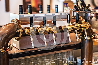 Vintage beer taps in the bar Stock Photo