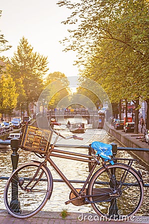 Vintage bike with canal in Amsterdam Stock Photo