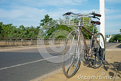 Vintage Bike on Street Paving Stock Photo