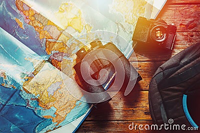 Adventure Discovery Scout Journey Concept. Retro Film Camera, Map, Backpack And Binoculars On Wooden Table, Top View Stock Photo