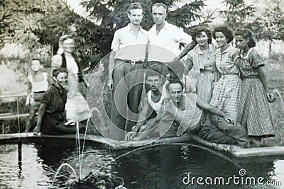 Vintage black and white photo of a group of young people 1950s European. Editorial Stock Photo