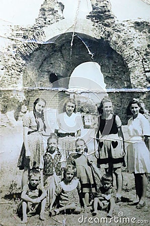 Vintage black and white photo of a group of young people 1950s European. Editorial Stock Photo