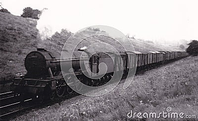 Vintage black and white photo of steam locomotive at Potter Bar 1951 Editorial Stock Photo