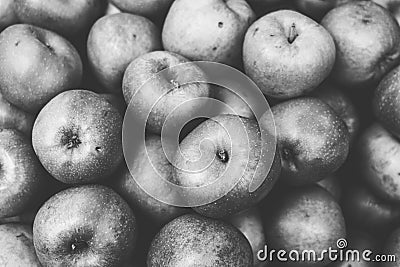 Black and white shot of a pile of apples Stock Photo