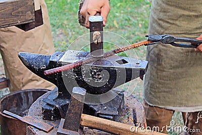 Vintage blacksmith tools on wooden table Stock Photo