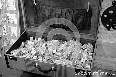 Vintage block collected in a suitcase on display Editorial Stock Photo