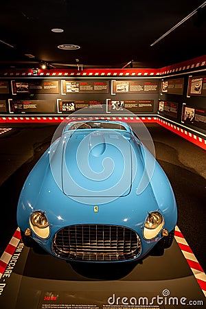 Vintage blue Ferrari sports car displayed inside a museum in Italy. Editorial Stock Photo