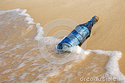 Vintage Bottle and Waves Stock Photo