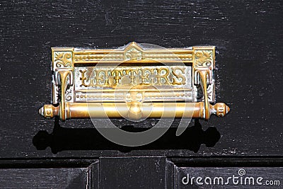 Vintage brass door knocker letter box Stock Photo