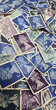 Vintage British postage stamps printed in the 60s and 70s Editorial Stock Photo
